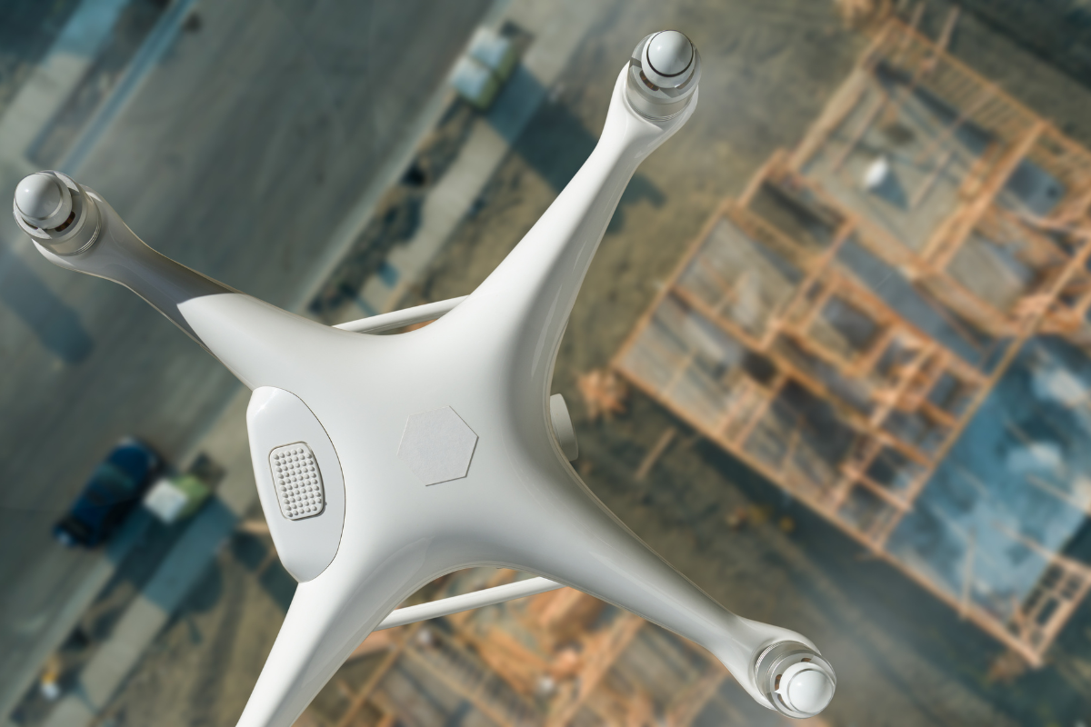 drone flying over industrial buildings