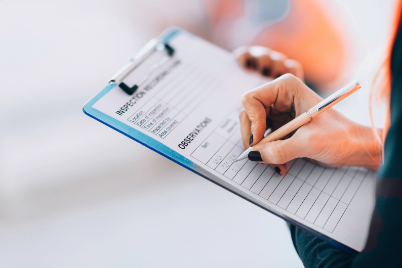 hand writing on facilities management checklist